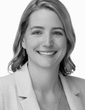 Stefanie Deal, Executive Vice President and Principal Architect, smiling in black and white professional headshot