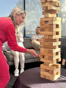 Woman in pink plays Jenga