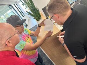 Three team members looking at the next clue