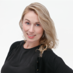 Kate, FPBA Senior Designer, smiling in professional headshot