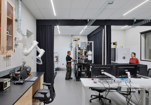 A researcher calibrates sensitive lab equipment in the DEEP Lab, built to support advanced research training. A CAS Architects, an FPBA Co. and Jensen Architects education project.